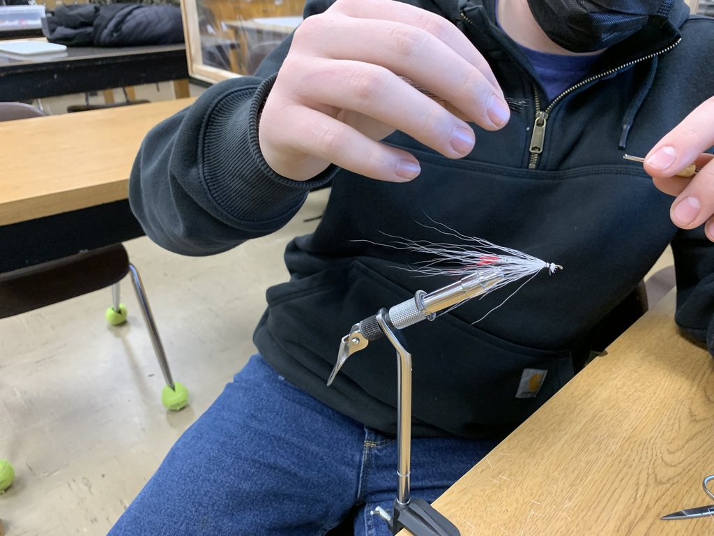 Student tying a fishing fly 
